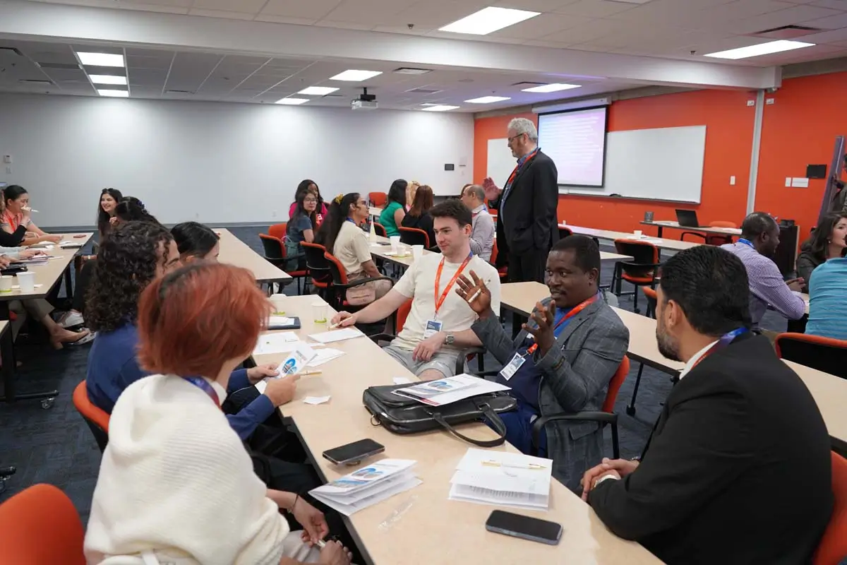 Conference attendees actively discussing