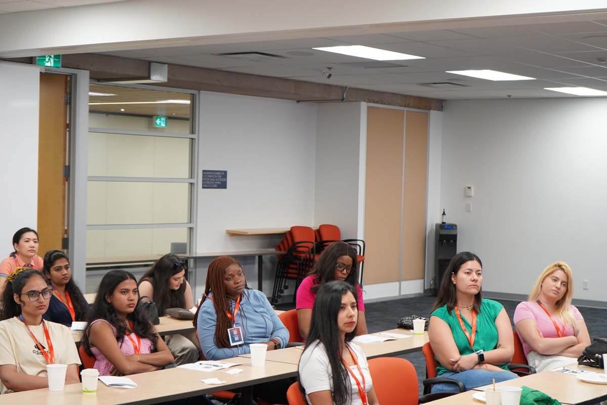 participants attentively listening to a speaker in our Conference in USA